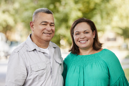Portrait Of Smiling Senior Couple On Suburban Streetの写真素材