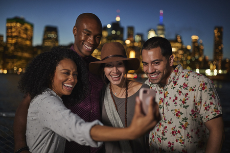 Group Of Friends Posing For Selfie In Front Of Manhattan Skylineの写真素材