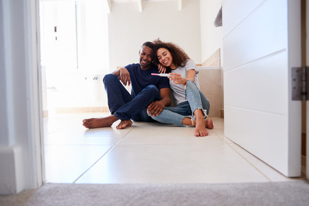 Couple Celebrating Positive Home Pregnancy Test Resultの写真素材