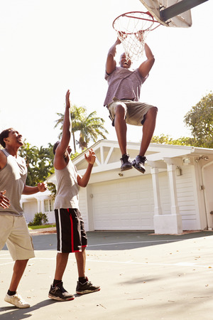 Group Of Young Men Playing Basketball Matchの写真素材