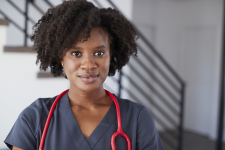 Portrait Of Female Nurse Wearing Scrubs In Hospitalの写真素材