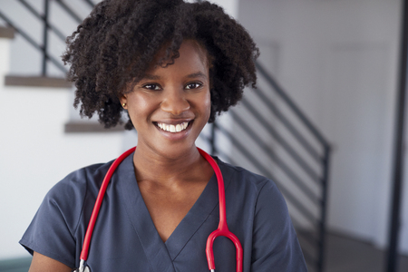 Portrait Of Female Nurse Wearing Scrubs In Hospitalの写真素材