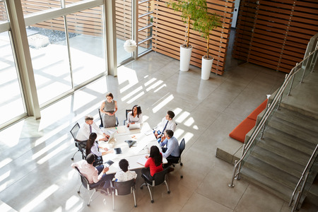 Female manager addressing a team meeting, elevated viewの写真素材