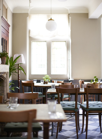 Tables Laid For Service In Empty Restaurantの写真素材