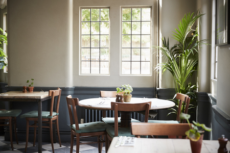 Tables Laid For Service In Empty Restaurant