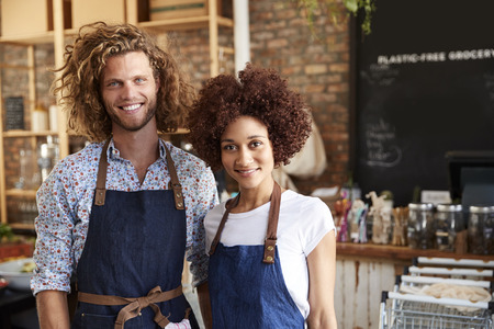 Portrait Of Male And Female Owners Of Sustainable Plastic Free Grocery Store
