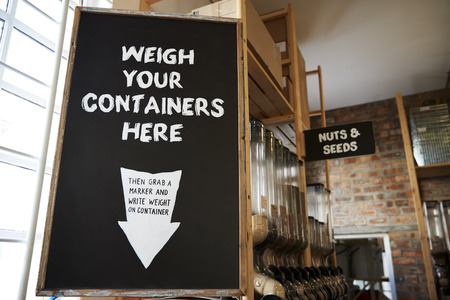 Weigh Your Container Sign In Sustainable Plastic Free Grocery Storeの写真素材