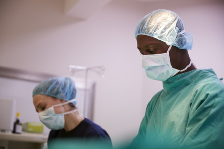 Surgical Team Working On Patient In Hospital Operating Theatre