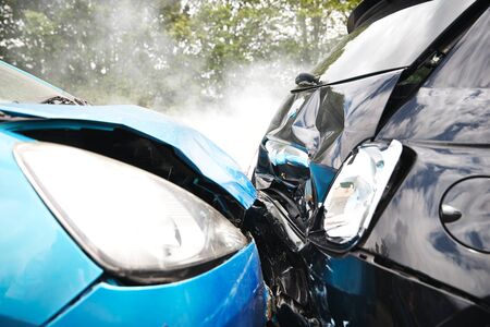 Close Up Of Two Cars Damaged In Road Traffic Accidentの写真素材