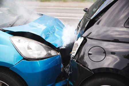 Close Up Of Two Cars Damaged In Road Traffic Accidentの写真素材