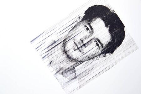 Mental Health Concept With Monochrome Picture Of Man Passed Through Paper Shredderの写真素材