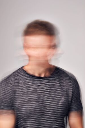 Concept Shot Of Man With Distorted Face Illustrating Mental Health Issuesの写真素材