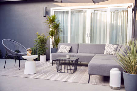 Outdoor Seating And Garden Furniture On Patio Of Contemporary Homeの写真素材