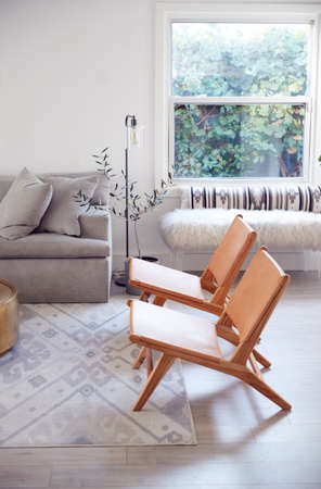 Interior View Of Beautiful Lounge With Sofas And Chairs In New Family House