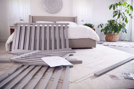 Instructions And Components For Self Assembly Baby Cot On Bedroom Floorの写真素材