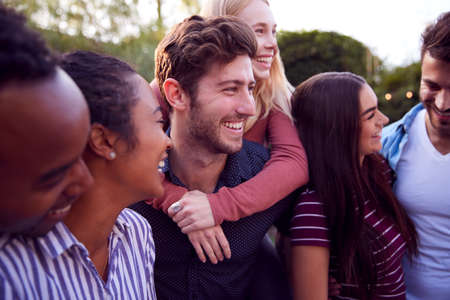 Group Of Multi-Cultural Friends Enjoying Outdoor Summer Garden Partyの写真素材