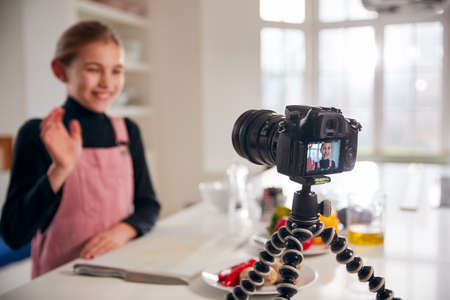 Young Girl Vlogger Making Social Media Video About Cooking For The Internet At Home
