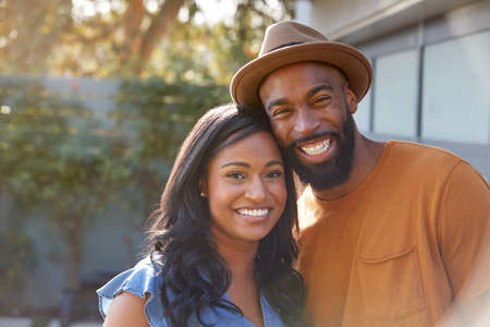 Portrait Of Smiling African American Couple Outdoors In Garden At Homeの写真素材