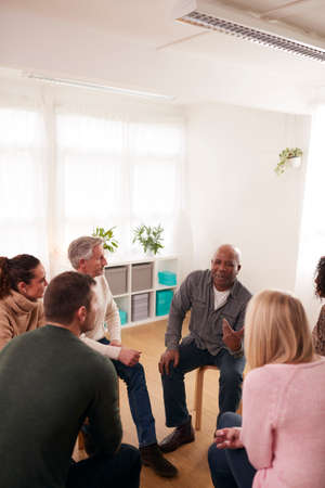 People Attending Support Group Meeting For Mental Health Or Dependency Issues In Community Spaceの写真素材
