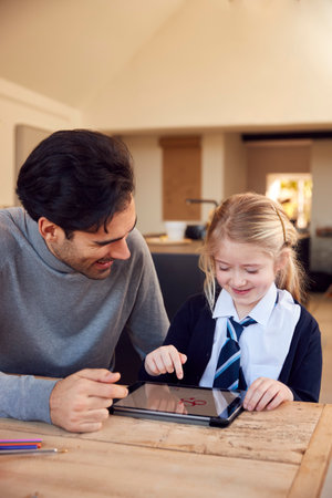 Father And Children Getting Ready To Leave Home For School In The Morning Standing By Doorの写真素材