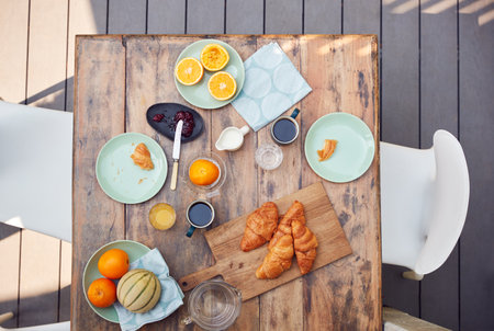 Overhead Shot Of Table Set For Breakfast Outdoors On Deck At Homeの写真素材