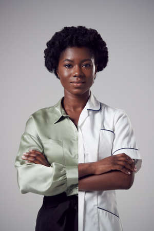 Concept Portrait Of Woman Showing Contrasting Day And Night Job Roles In Business And As Nurseの写真素材