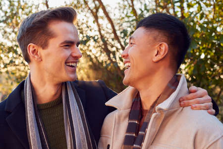 Loving Same Sex Male Couple On Walk In Countryside Togetherの写真素材