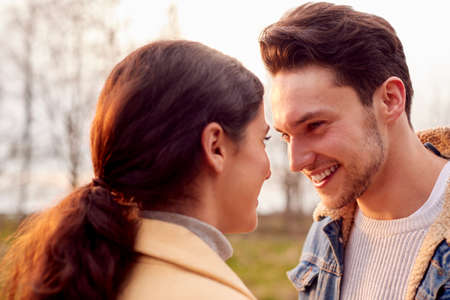 Loving Transgender Couple Enjoying Walk In Autumn Or Winter Countryside