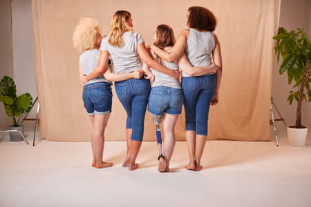 Rear View Of Body Positive Diverse Casually Dressed Women Friends One With Prosthetic Limbの写真素材