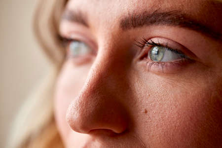 Studio Portrait Shot Face And Eyes Of Confident Natural Woman