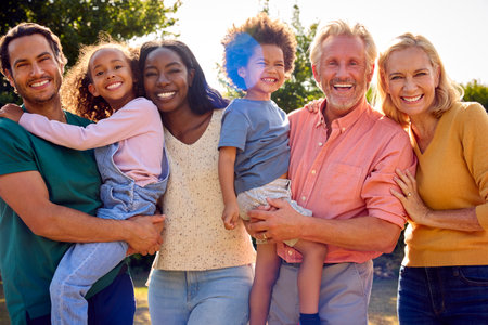 Portrait Of Multi-Generation Family At Home In Garden Together