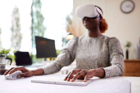 Woman Working From Home Office Sitting At Desk Wearing VR Headset Using AR Technology