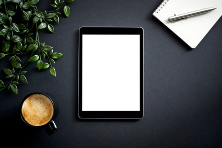 Overhead Flat Lay Business Shot Of Digital Tablet With Notepad Pen Cup Of Coffee And Plant
