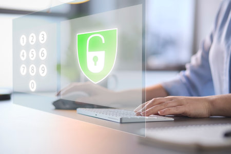 Online Security Concept With Woman Using Laptop With Graphic Overlay Of Lock And PIN Number Keypad