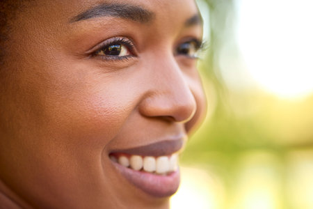 Close Up Portrait Of Smiling Beautiful Woman Standing Outdoors
