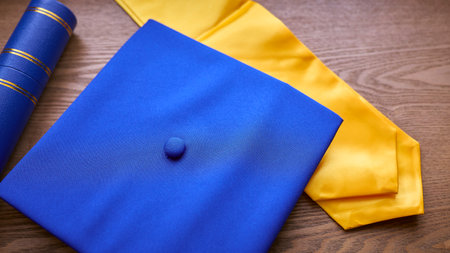 Close Up Of Graduation Robe, Mortar Board and Qualification Or Degreeの写真素材