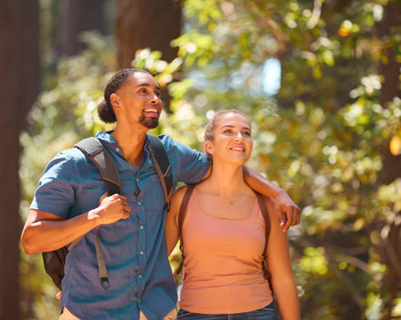 Close Up Of Loving Young Active Couple Wearing Backpacks Hiking Along Trail Through Countrysideの写真素材