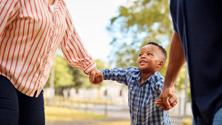 Close Up Of Grandparents Holding Hands With Grandson Outdoors In Countryside Or Gardenの写真素材