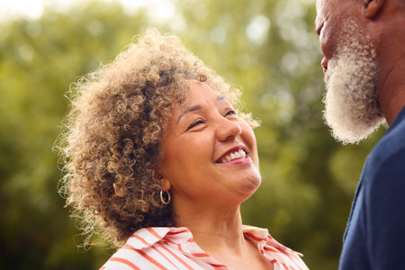 Close Up Of Loving Senior Couple Talking Outdoors In Countryside Or Gardenの写真素材