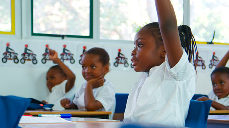 Children actively participate in a classroom discussion.