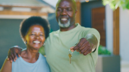 Portrait Of Senior Couple Outdoors Holding Keys To Dream Homeの写真素材