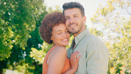 Portrait Of Loving Multi-Racial Couple Standing Outdoors In Garden Park Or Countrysideの写真素材