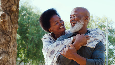 Portrait Of Loving Couple Standing Outdoors In Garden Park Or Countryside Huggingの写真素材