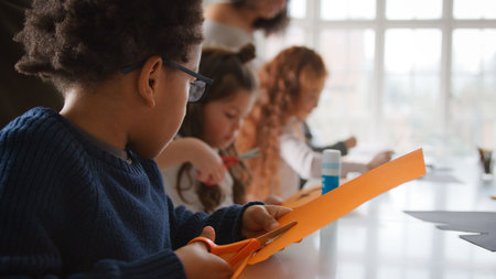 Group Of Children At Home With Mother Having Fun Making Craft Togetherの写真素材