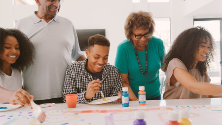 Grandparents With Adult Grandchildren Doing Craft At Home Togetherの写真素材