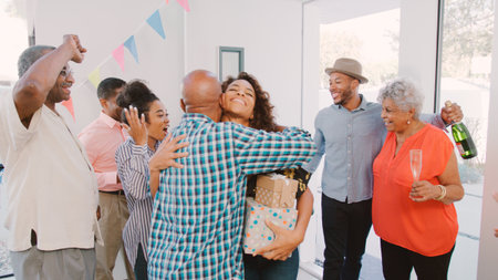 People Hugging As They Arrive At Multi Generation Family House Partyの写真素材