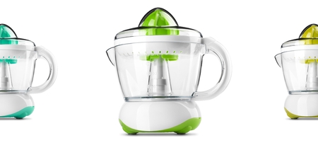 Colorful electric orange juicer isolated on white backgroundの写真素材