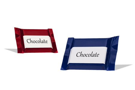 Chocolate wraped in colorful foil isolated at white backgroundの写真素材