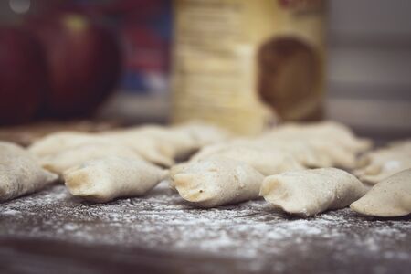 Homemade Dumplings prepared on the brown wooden table by traditional wayの写真素材