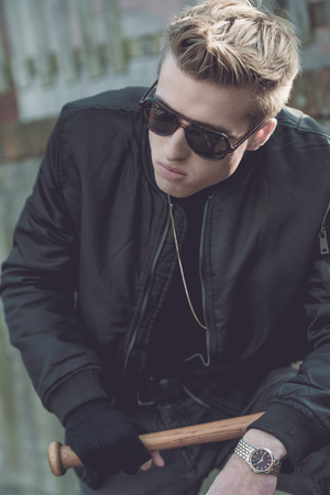 portrait of Hooligan with baseball bat and glassesの写真素材